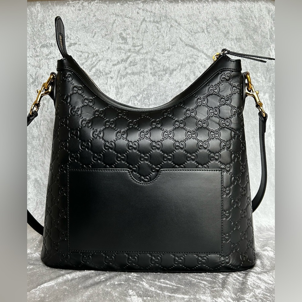 Gucci Signature Hobo, Black leather exterior, tan cloth interior.